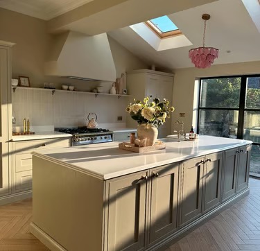 White quartz kitchen island by RH Stone Surfaces