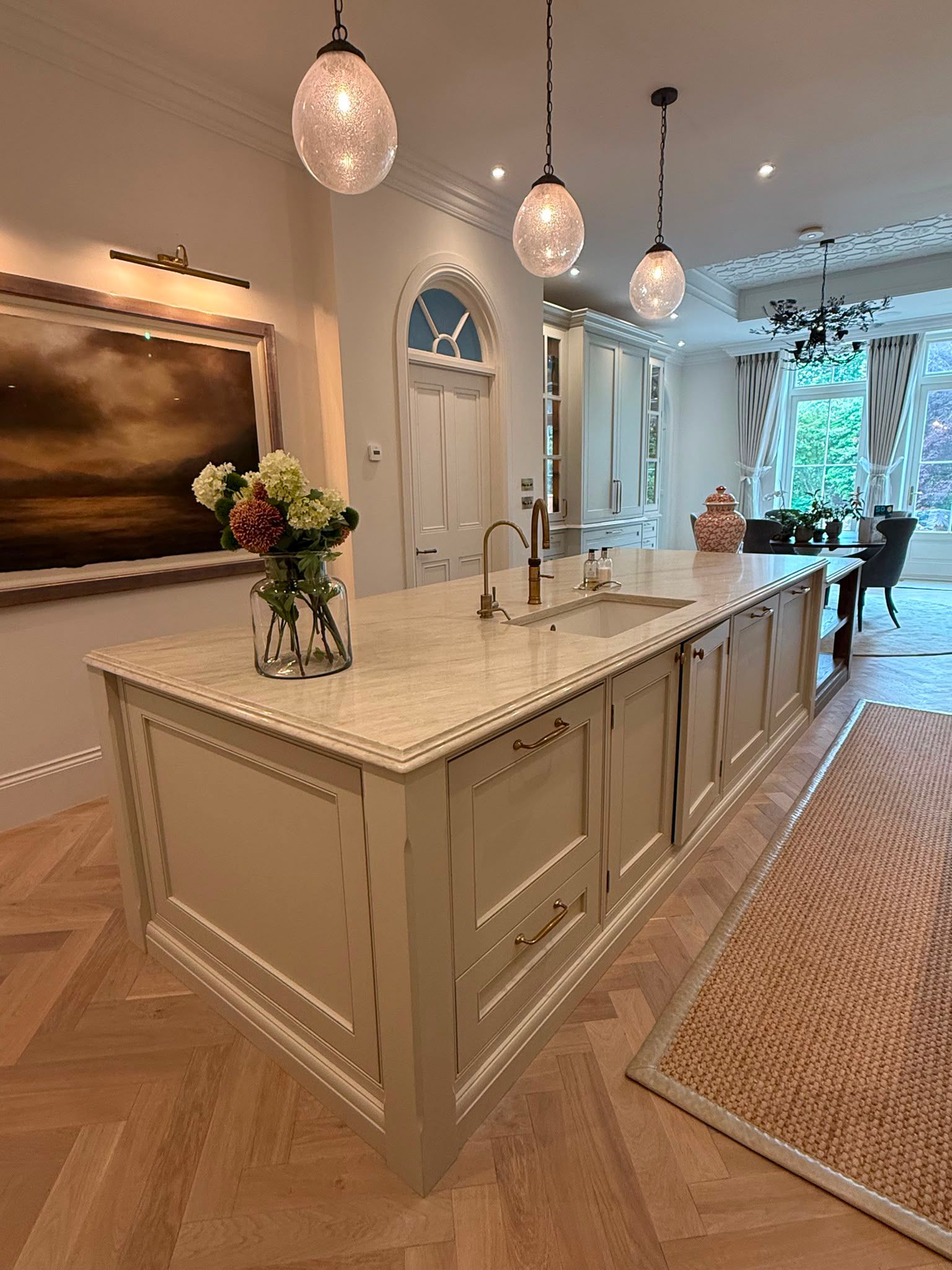 Taj Mahal quartz waterfall-edge kitchen island