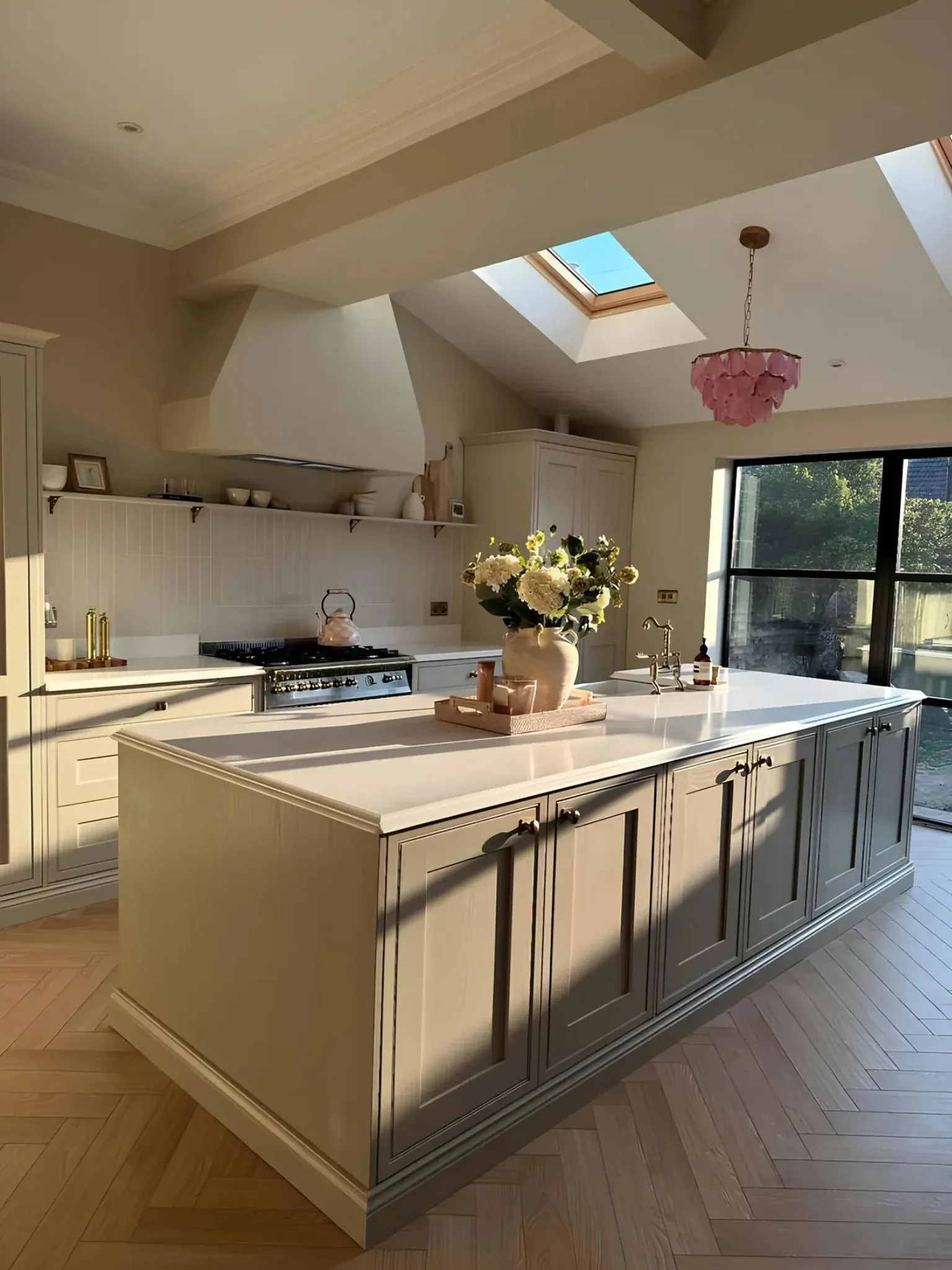 White quartz worktops on a large Shaker kitchen island