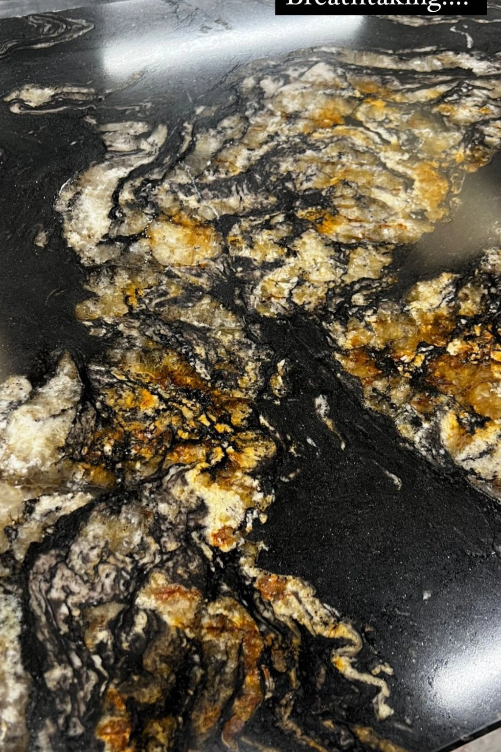 Black and gold granite worktop showing premium natural stone detail