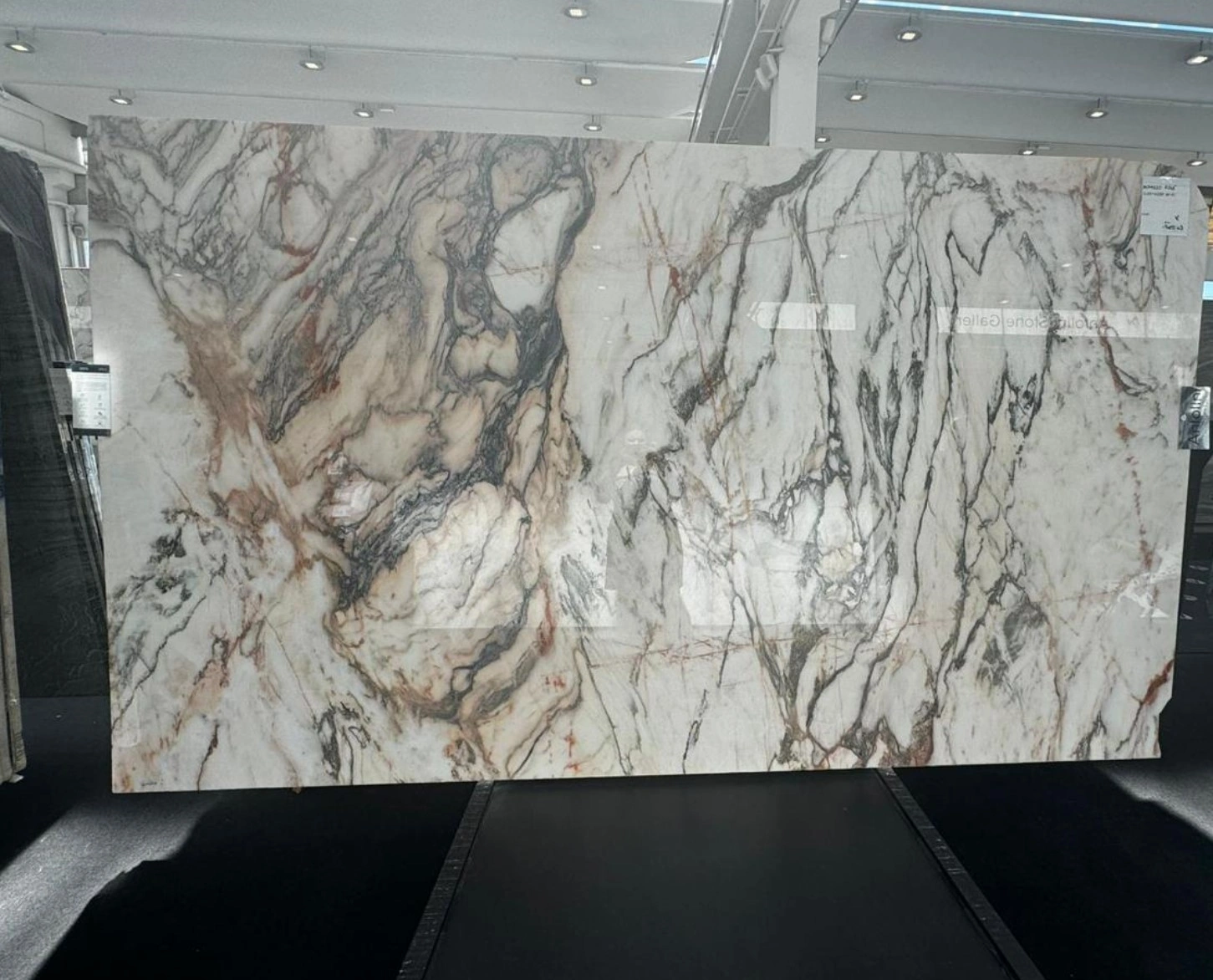 White granite slab with bold veining and natural contrast