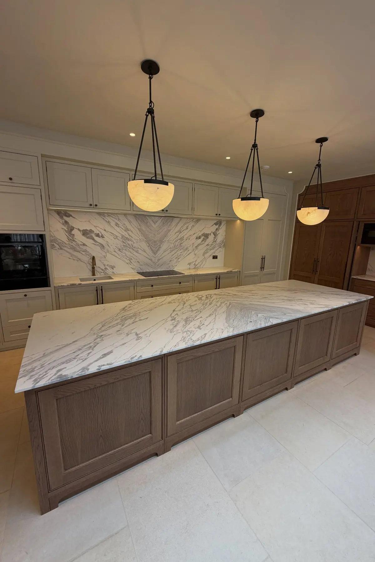 Natural marble kitchen island and bookmatched splashback for Northumberland projects around Alnwick NE66